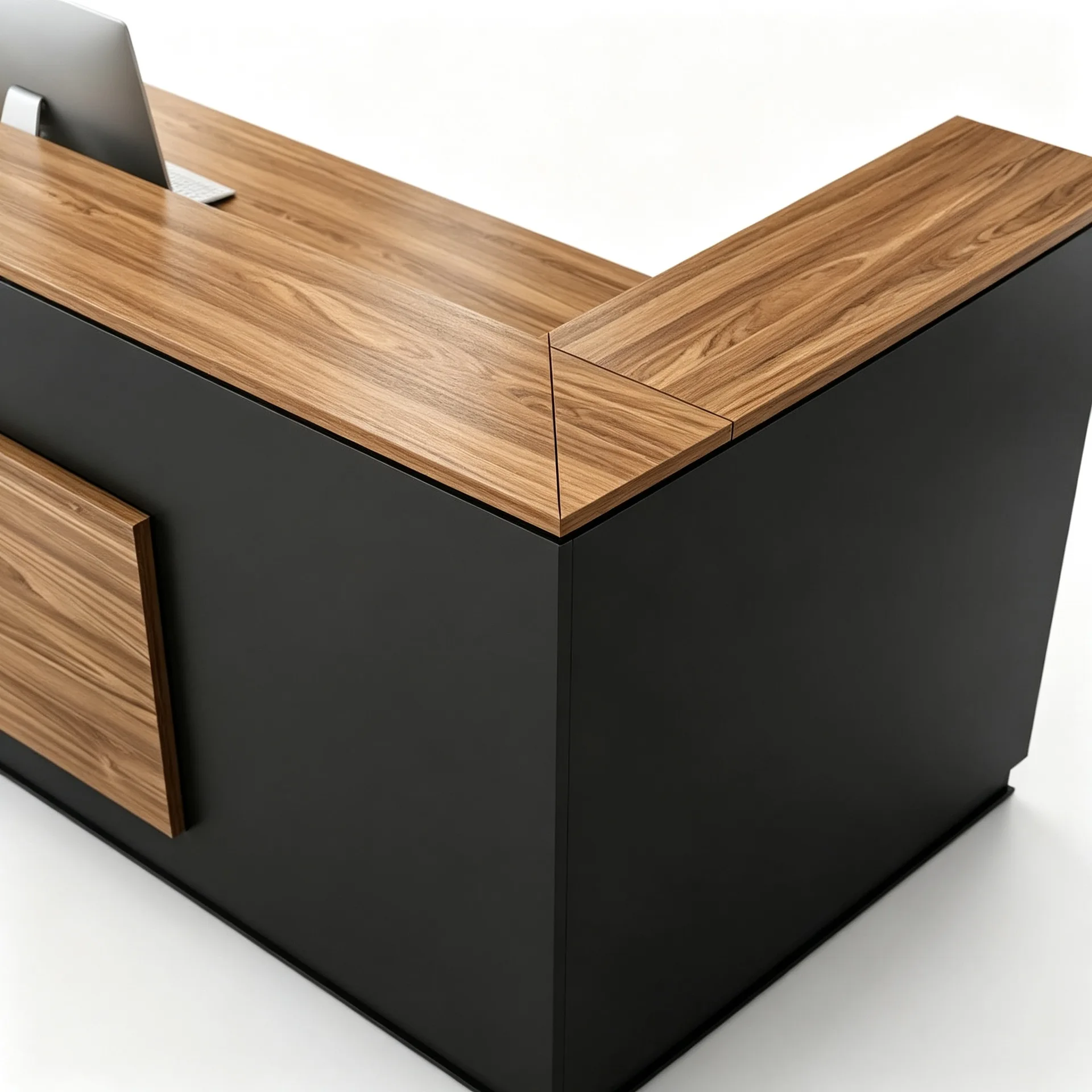 Close-up of the wood-grain counter return and black corner panels on an L-shaped reception desk