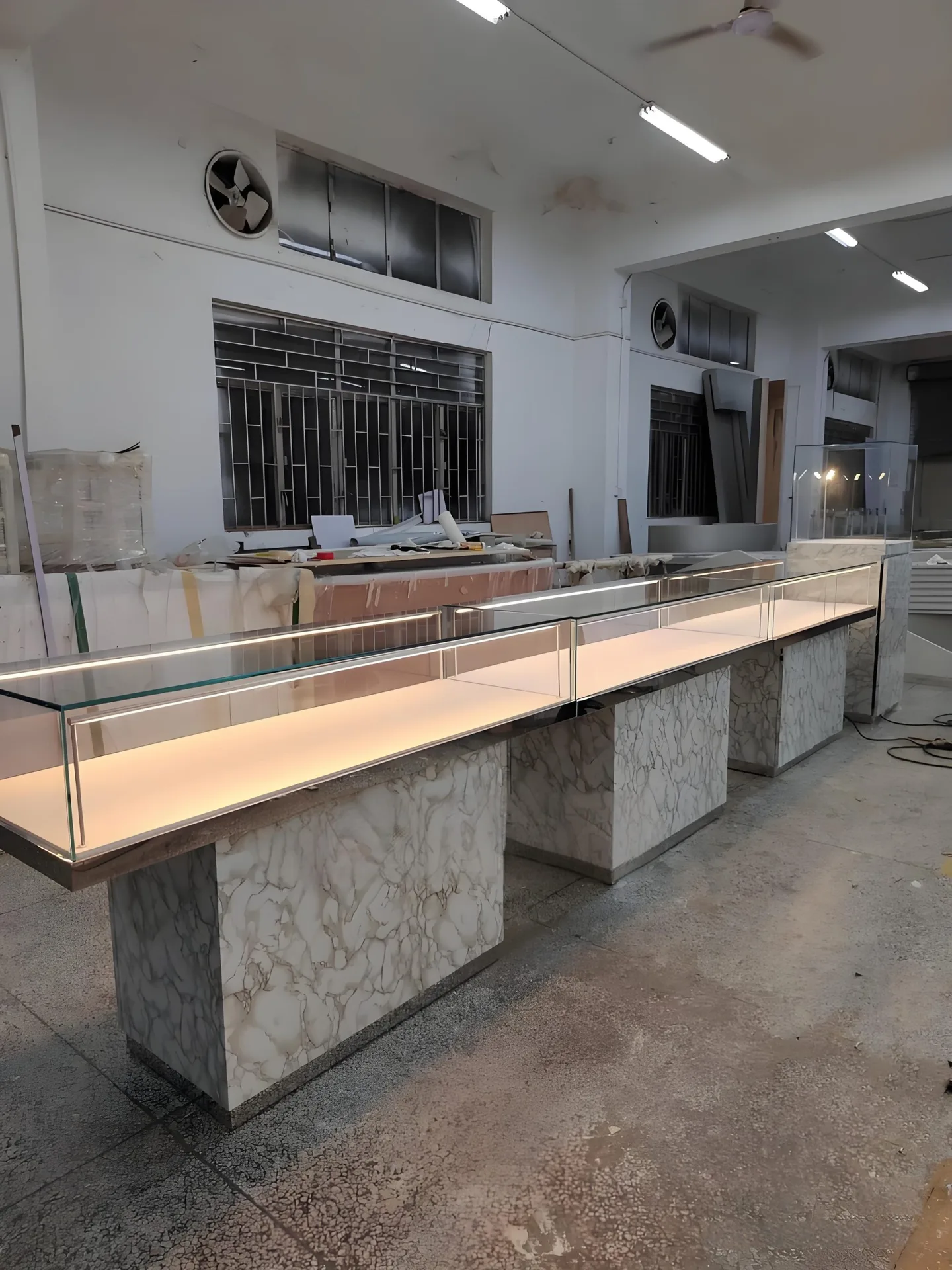 Long Marble‑Effect Base Glass Jewelry Display Counter With Built‑in LED Lighting