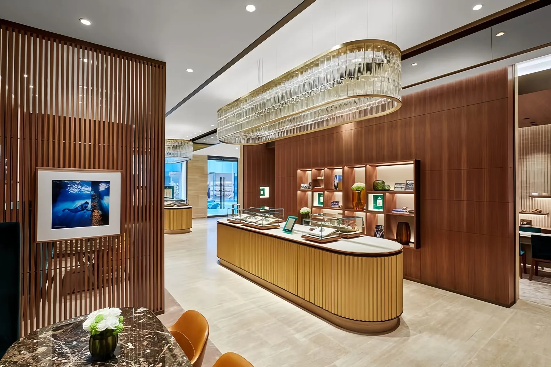 Luxury Jewelry Boutique Interior Design | Custom Wood Paneled Showroom with Statement Chandelier — view 7