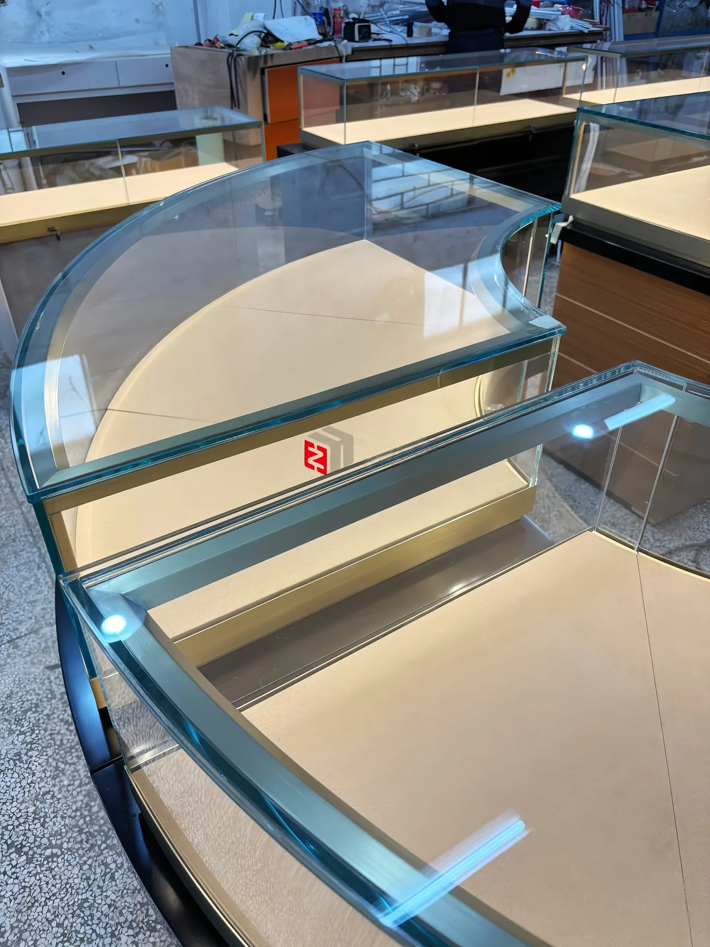 Modern Curved Wood Jewelry Display Island Counter with Glass Top & LED Lighting — view 7