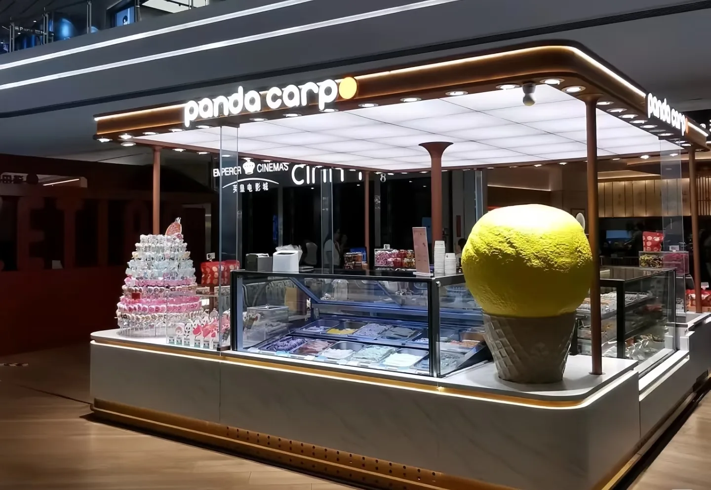 Modern Ice Cream Kiosk Design with Eye-Catching Focal Sculpture — view 2