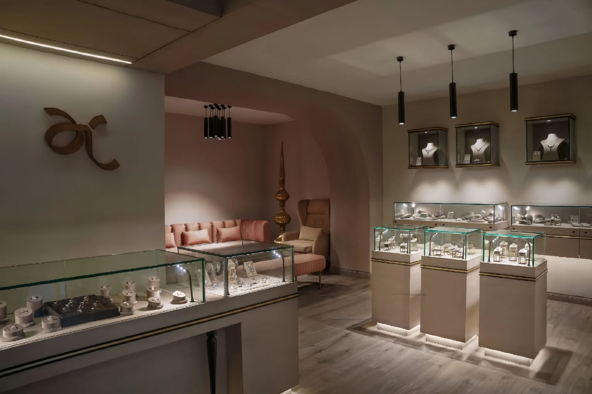 Modern Soft‑Neutral Jewelry Boutique Interior with Pedestal Display Showcases