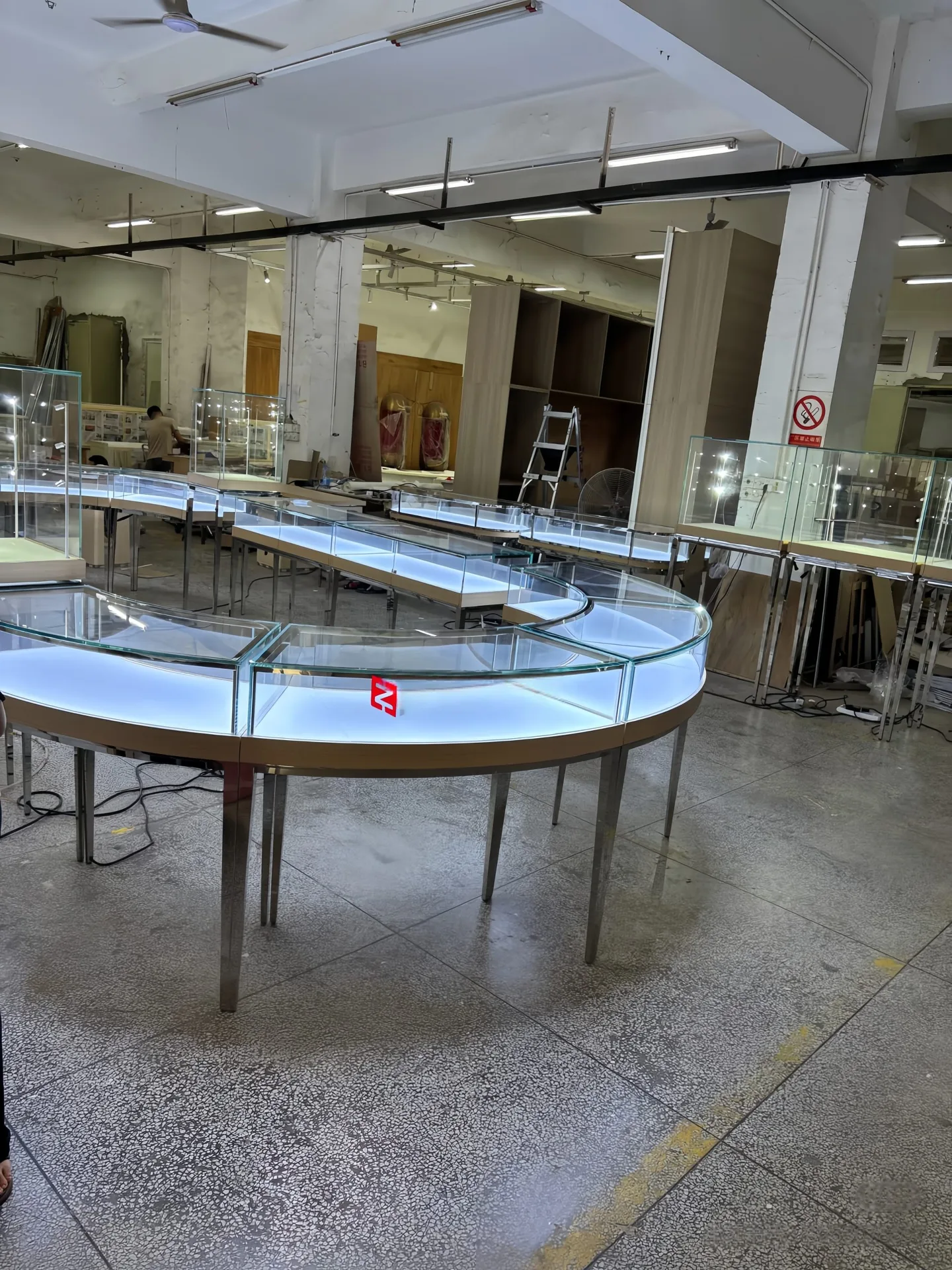 Modular Curved Glass Jewelry Display Counter | S-Shaped Retail Island with Metal Legs & White Top — view 6
