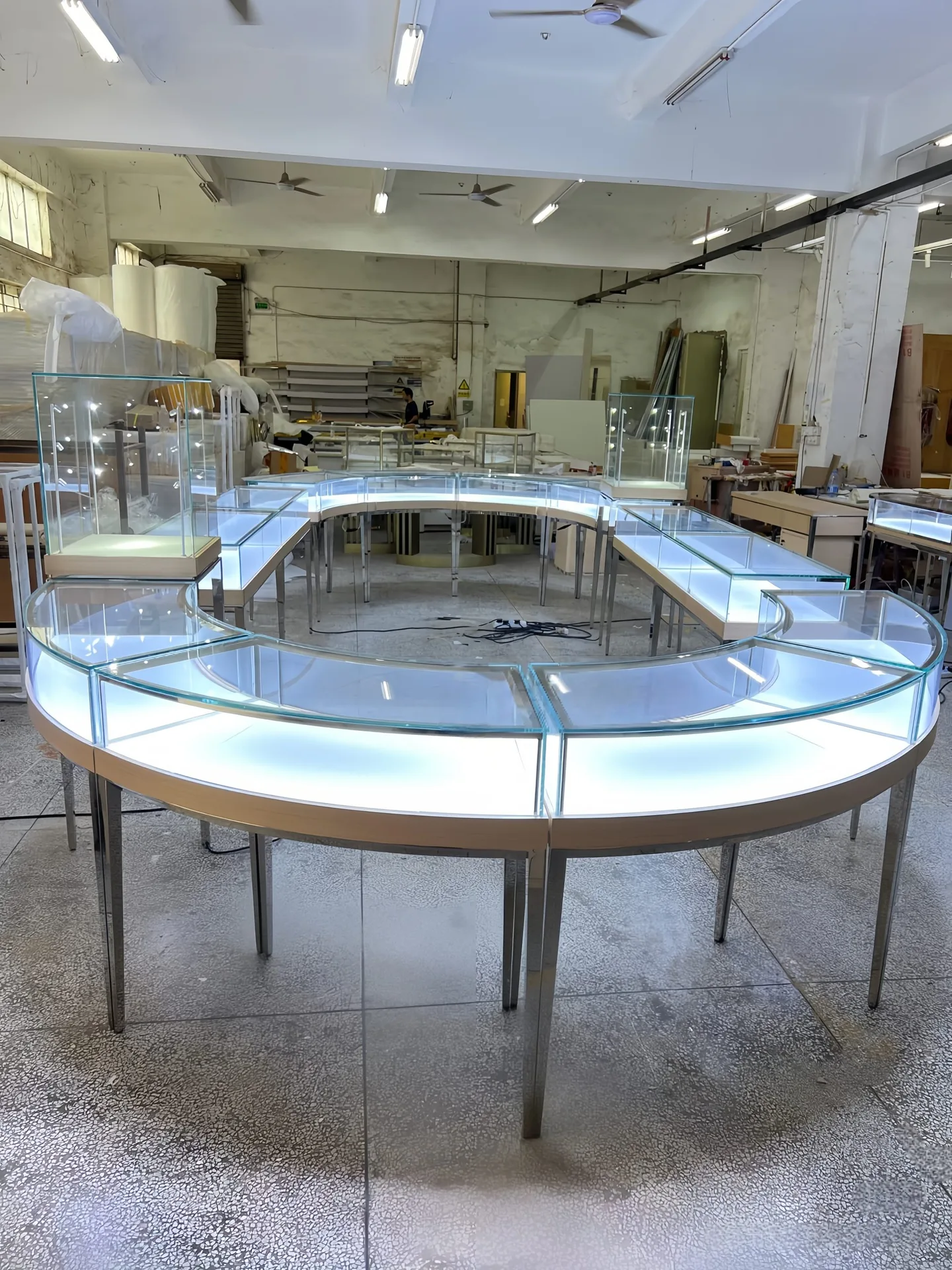 Modular Curved Glass Jewelry Display Counter | S-Shaped Retail Island with Metal Legs & White Top — view 7