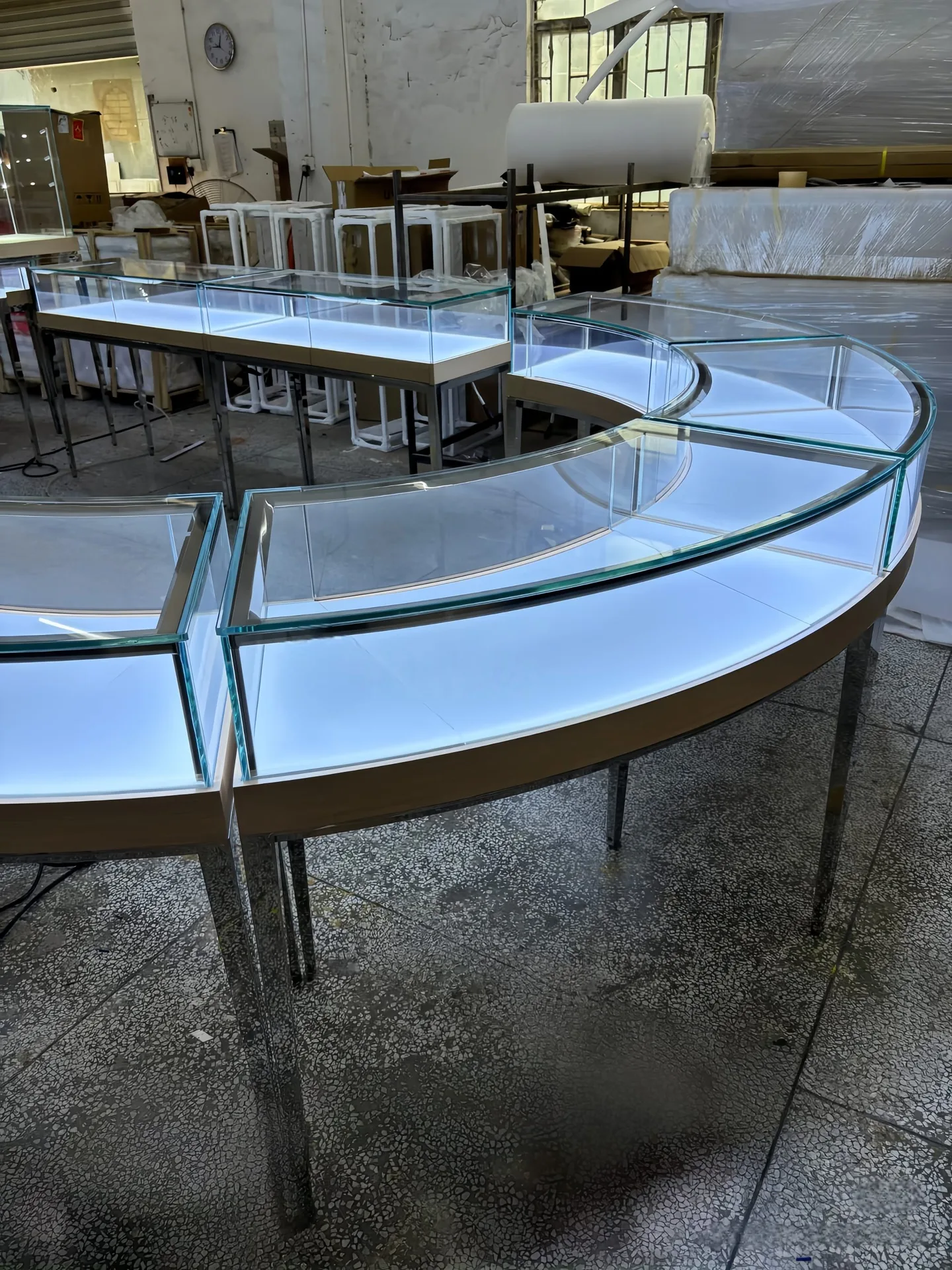 Modular Curved Glass Jewelry Display Counter | S-Shaped Retail Island with Metal Legs & White Top — view 4