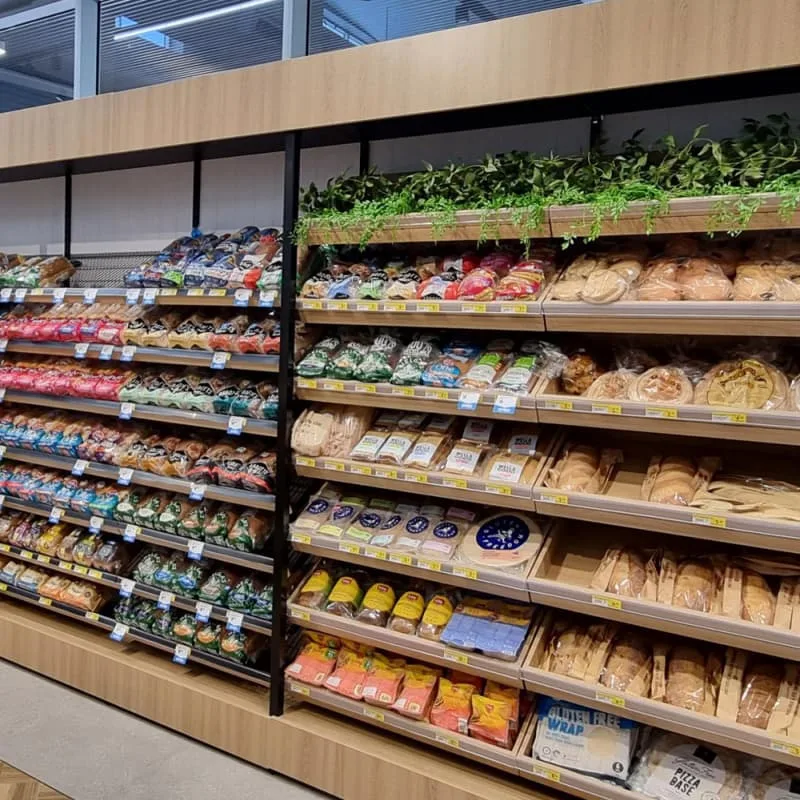 Wood and metal bakery shelving units for bread and pastry retail display — view 3