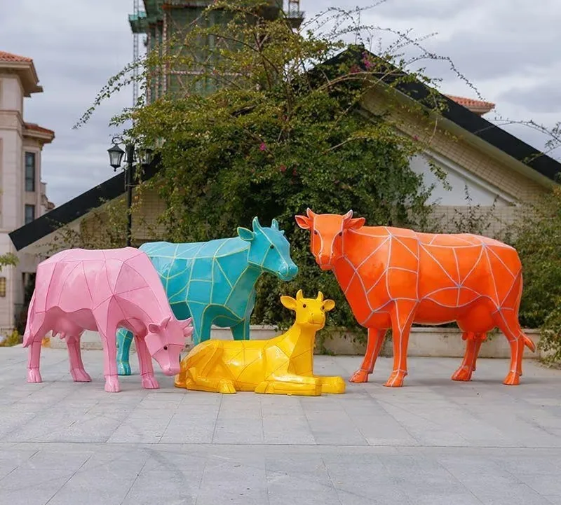 Custom Geometric Fiberglass Cow Sculptures | Colorful Public Art Series