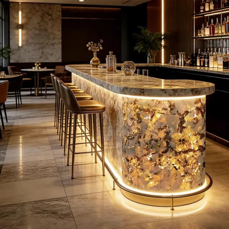Onyx Counter | Backlit Bars Counters For Sale – Glowing golden onyx bar counter builds warm retro vibe for upscale cocktail l