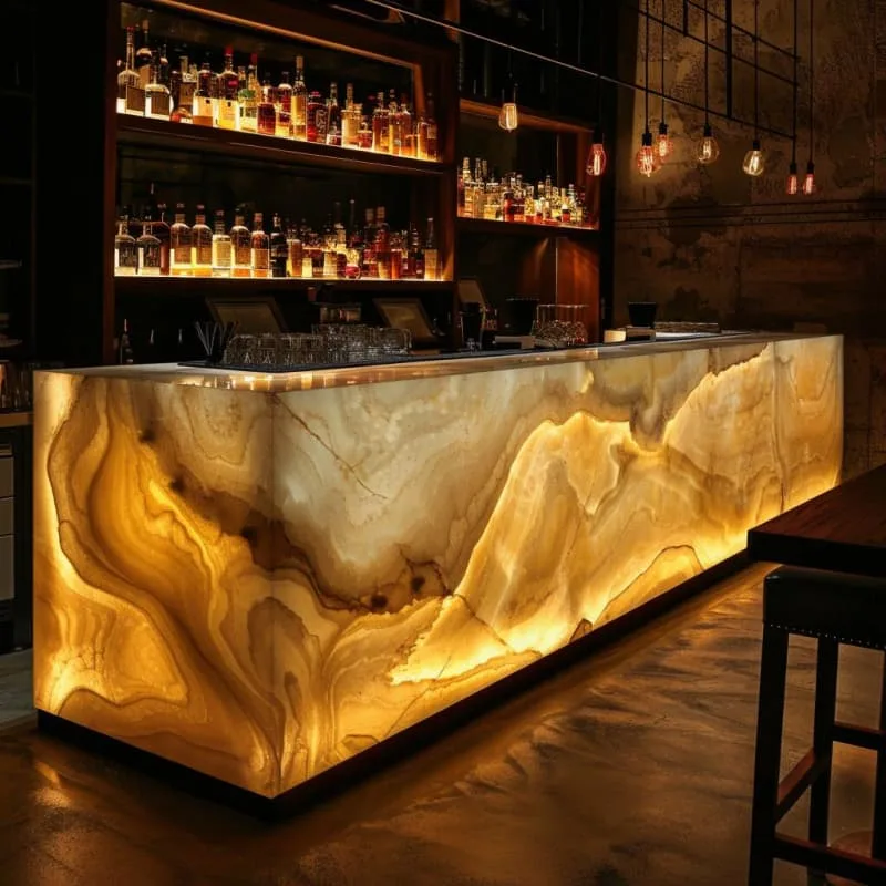 Onyx Counter | Backlit Bars Counters For Sale – Glowing golden onyx bar counter builds warm retro vibe for upscale cocktail l