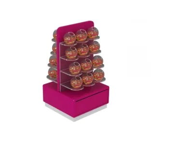 Pink freestanding candy display with rows of round clear containers