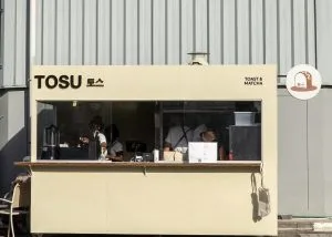 Outdoor Kiosk Booth For Sale | Custom Design – Cream‑Colored Outdoor Food Kiosk With Branding Display & Service Window image 