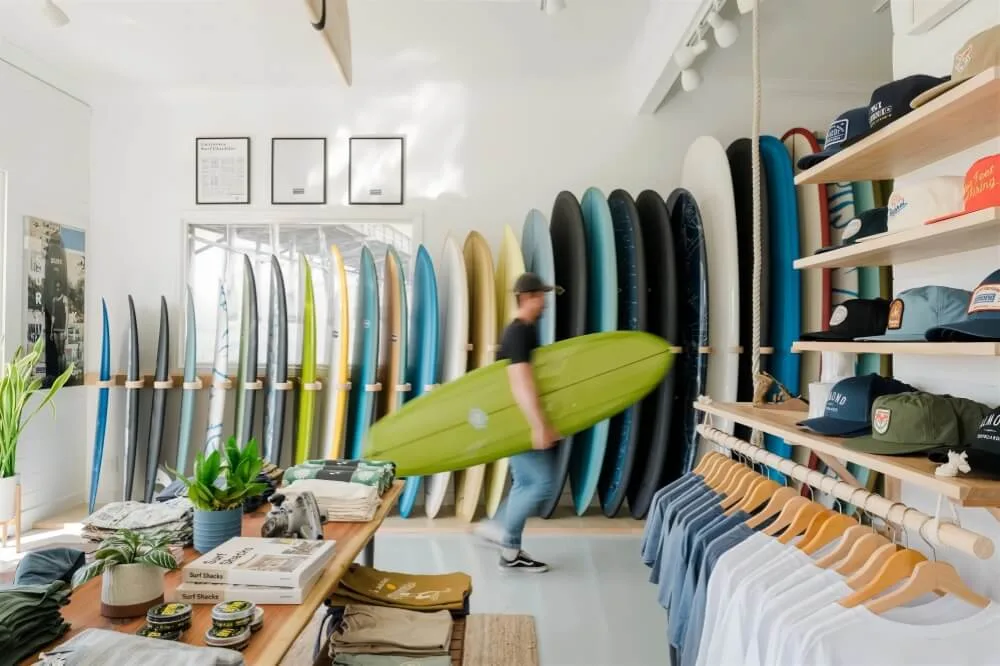 Surf Skate Shop Retail Displays, Design Fixtures – Stylish and simple surf shop design with green reception desk and wall she