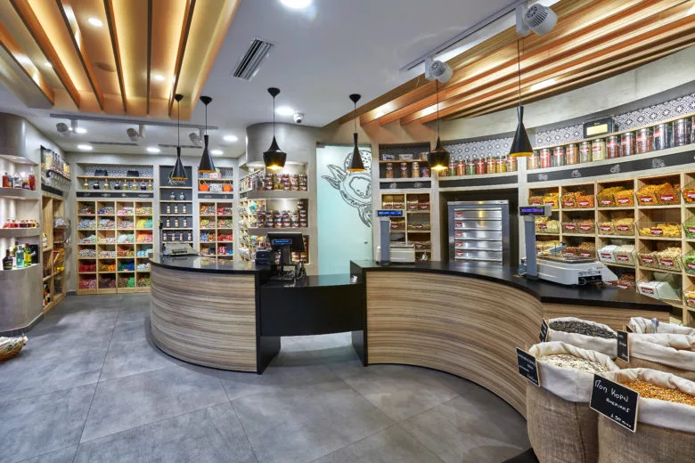 Warm & Modern: The Interior Design of Tameio Nuts Shop With Wooden Racks & Shelves